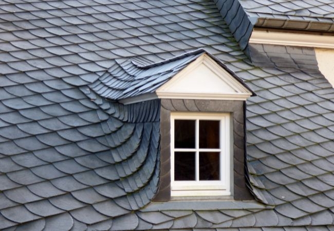 Are asbestos considerations addressed during roof restoration?