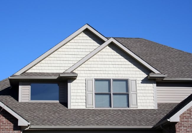 What professional certifications and roofing qualifications does Clayton Roof Restoration hold?