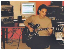 In studio playing guitar...