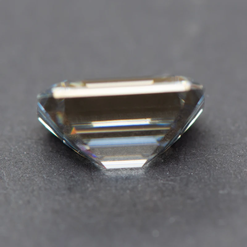 https://filedn.com/lbDn48ArIEU8tstyEOW46uV/4sale/Moissanite%20Loose%20Stones%20/Charming%20Gemstone%20Store-Ghost-Gray-Emerald-Cut-1-5-Carats-3.webp